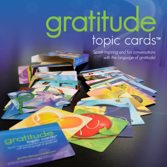 Image of colorful, 3.5"x3.5" glossy cards spilled onto a table. Shows the variety of cards in the GTC deck.